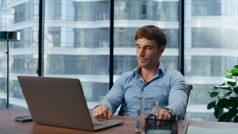 Image of a man working on a laptop, representing short-term productivity goals