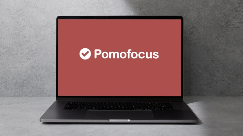 A laptop displays the Pomofocus logo, showing one of the best free productivity apps
